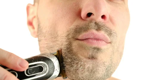 Man trim his beard, close up. Male skin care and beard style concept Stock Footage 236453557