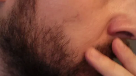 Man Trimming Beard in Close Up Stock Footage 34480954