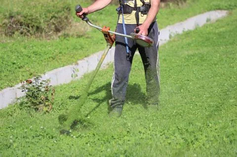 Man trimming the grass Stock Photos