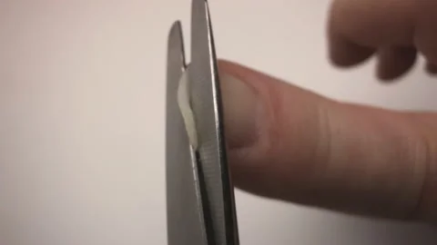 Man trims his fingernails. Action camera on scissors Stock Footage 146782357