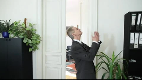 A man triumphs in office Vídeos de archivo 8986830