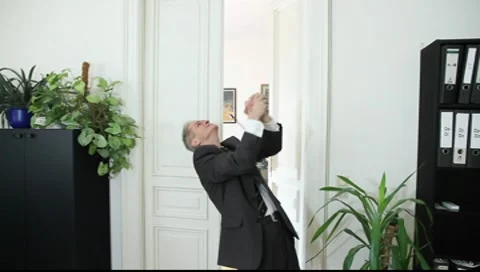 A man triumphs in office Vídeos de archivo 8987071