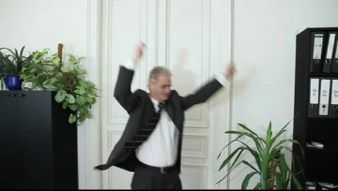 A man triumphs in office Vídeos de archivo 8987094