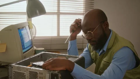 Man Troubleshooting Desktop Computer in Workshop Stock Footage 341428285