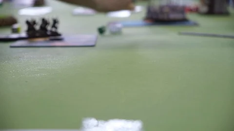 Man trow dice on green table for board game Stock Footage 114004178