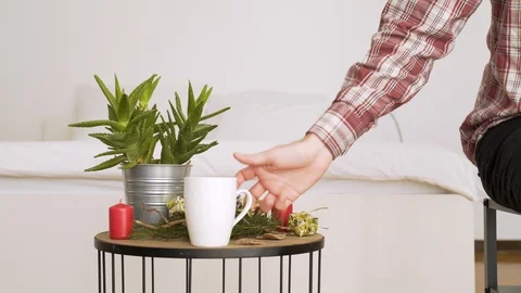 Man try to put wallet in bedside table with authentic Chrismas decoration. Video stock 102654456