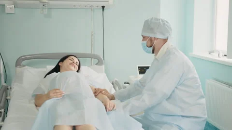 Man trying to calm down his pregnant wife before labour Stock Footage 162976304