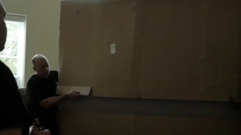 Man Trying Carry Large Piece Of Furniture Stock Footage 129499772
