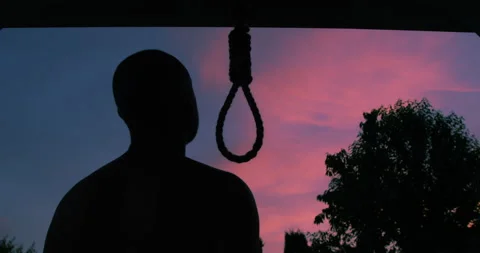 Man Trying to Commit Suicide by Hanging Himself on a Hangman Rope 库存影片 132937437