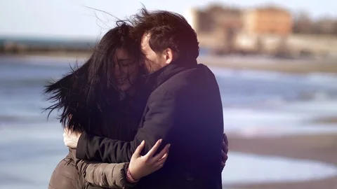 Man trying to console sad girlfriend slow motion Stock Footage 118644386