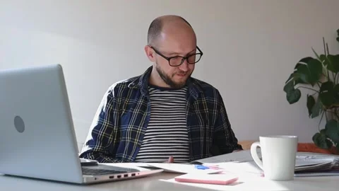 Man trying to deal with bills. Stock Footage 244008145
