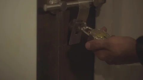 Man trying different keys on a lock - Shot on A7SII Stock-Footage 113604814