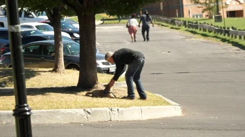 Man trying to get his sitting down to get up Stock Footage 81495094