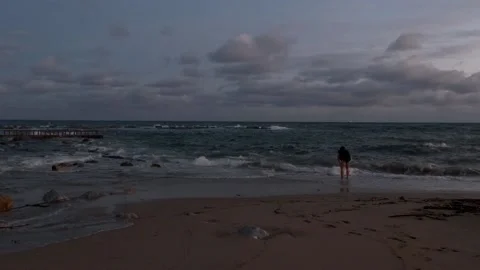 Man Trying To Get Used To Cold Water At Night in Barcelona, Spain Stock Footage 175271761