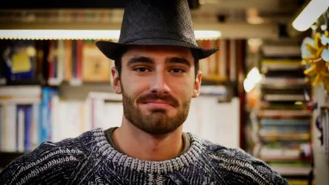 Man trying hats on Stock Photos