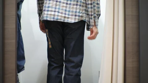 Man trying jeans 스톡 동영상 97764143