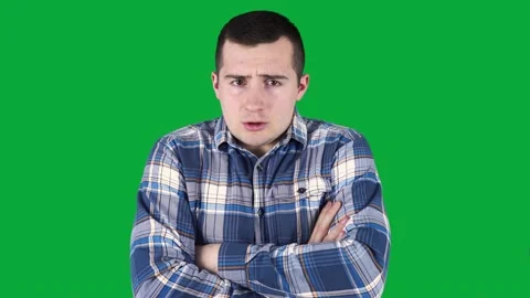 A man trying to keep warm by moving in place on a green screen. Stock Footage 151192556