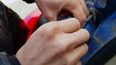 Man is trying to pull the socle from the bulb holder Video stock 80528136