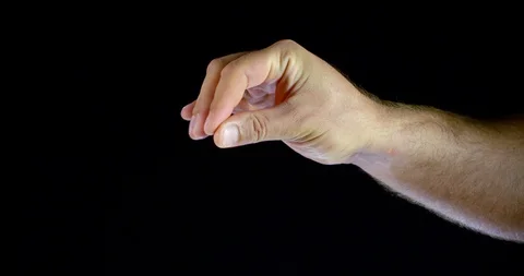 Man is trying put his fingers together, close-up view of his hand in black 動画素材 116760280