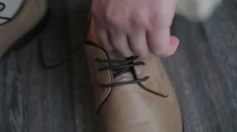 Man trying shoelaces Stock Footage 45792482