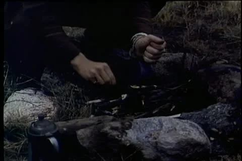 Man trying to start a campfire Stock Footage 25207129