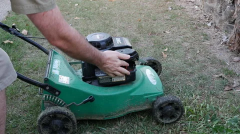 Man Trying to Start Lawn Mower - Wont Start Stock Footage 63371466
