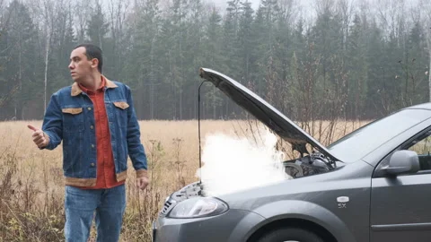 Man trying to stop the car on the road. Stock Footage 145121858