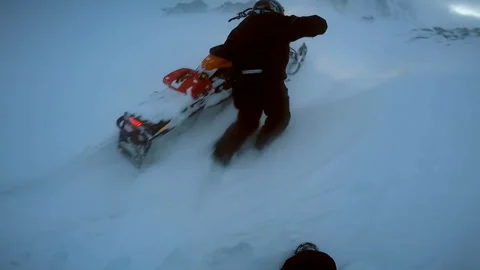 Man trying to take out a snowmobile from a snowdrift Video stock 102161219