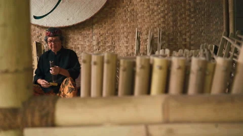 Man tuning angklung by cutting Stock-Footage 85810604