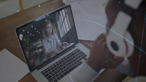 Man tuning headset in remote tech meeting as woman reviewing papers activating Stock Footage 314455464