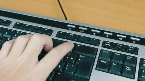 A man is tuping on the keyboard numbers Stock Footage 70566714