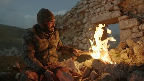 Man Turn on Fire in Mountain Stock Footage 75207162