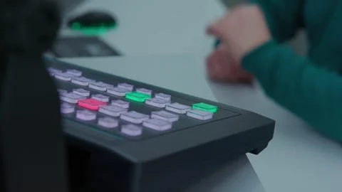 A man turned on black control panel and switching channels Stock Footage 271355566