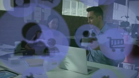 Man turning and reaching for mug as laptop showing code and overlay icons Stock Footage 333300301