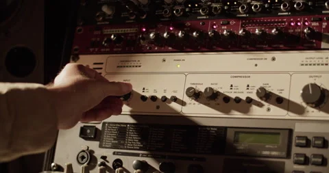 Man turning control knob on amplifier Stock Footage 201849192