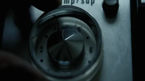 Man turning a dial with numbers Stock Footage
