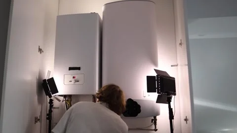 Man turning on home boiler checking temperature and preparing heating system for Stock Footage 318868681