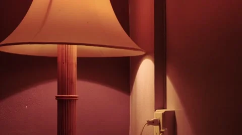 Man is turning on a lamp Stockbeeldmateriaal 63902421