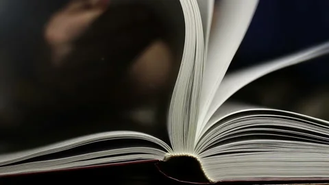 Man turning pages of a book Stock Footage 103719481