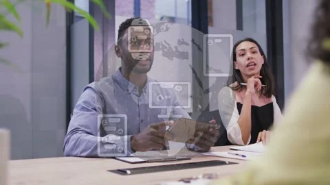 Man turning tablet toward other, pitching globe tech icons fading over speakers, Stock Footage 334322101