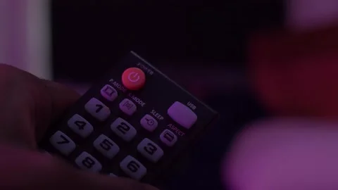 Man Turning off TV with Remote Stock Footage 157942277