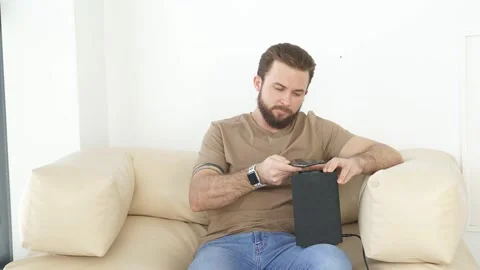 Man turning on wireless smart column with the use of smartphone. Stock Footage 159860891