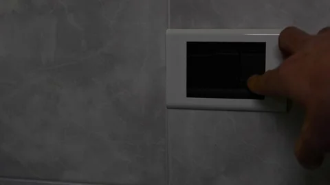 Man turns on and off the light Stock Footage 81069033