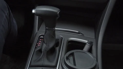 Man turns on an automatic transmission Stock Footage 129967358