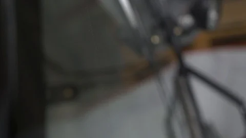 The man turns on the automatic wipers on a tractor Stock Footage 128688412