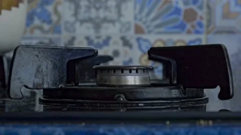 The man turns on the burner from a different angle Stock Footage 163991717