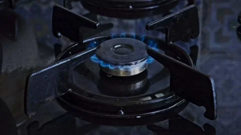 Man turns on the burner Stock Footage 163991719