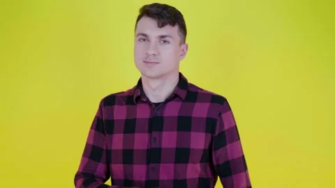 Man turns to the camera, crosses arms on stomach and says what Stock Footage 133802850