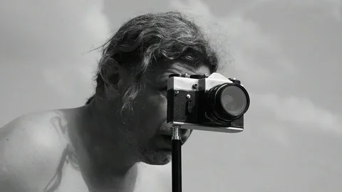 Man turns on camera timer Stock Footage 110844820