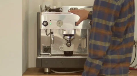 The man turns on the coffee machine, makes coffee and takes the Cup 4k Video stock 58491847